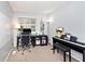 Well-lit office area with neutral walls, a spacious desk, and a modern office chair at 8024 Sunfield Ct # 5-B, Indianapolis, IN 46214
