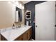 Modern bathroom with a marble countertop vanity and a stylish mirror at 8206 Bull Run Ct, Indianapolis, IN 46227