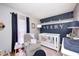 Adorable Bedroom with a crib, rocker, and stylish decor for a baby's room at 8206 Bull Run Ct, Indianapolis, IN 46227