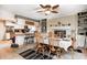 Inviting dining area with a table set for six, nestled between the kitchen and fireplace at 8206 Bull Run Ct, Indianapolis, IN 46227
