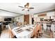 Open dining area adjacent to the living room, featuring a ceiling fan and generous seating at 8206 Bull Run Ct, Indianapolis, IN 46227