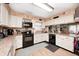 Traditional style kitchen featuring neutral-toned walls, white cabinets, and modern appliances at 8206 Bull Run Ct, Indianapolis, IN 46227