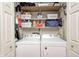 Convenient laundry room with washer, dryer, and ample storage at 8206 Bull Run Ct, Indianapolis, IN 46227