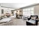 Cozy living room showcasing a seamless transition into the dining area, with ample seating at 8206 Bull Run Ct, Indianapolis, IN 46227