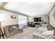 Spacious living room with plush sofas, large windows, and neutral decor at 8206 Bull Run Ct, Indianapolis, IN 46227