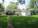 Well-maintained home with a spacious backyard, patio, and additional storage shed at 852 Walnut St, Greenfield, IN 46140