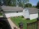 Well-maintained backyard featuring a lush lawn, a shed, and garden, offering a private outdoor oasis at 852 Walnut St, Greenfield, IN 46140