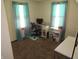 Bright bedroom or office featuring natural light from two windows and a dedicated desk space for work or study at 852 Walnut St, Greenfield, IN 46140