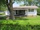 Charming home featuring a covered front porch, perfect for relaxing outdoors at 852 Walnut St, Greenfield, IN 46140