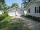 Detached two-car garage with white siding and ample parking space at 852 Walnut St, Greenfield, IN 46140