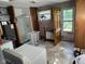 Functional laundry room featuring a washer, dryer, shower, and convenient access to the backyard at 852 Walnut St, Greenfield, IN 46140