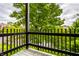 Relaxing outdoor view from the balcony, showcasing the scenic surrounding greenery and neighborhood at 8690 Jaffa Ct W Dr # 28, Indianapolis, IN 46260