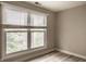Bedroom with natural light coming from a large window. Views of foliage and trees at 8690 Jaffa Ct W Dr # 28, Indianapolis, IN 46260