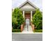 Attractive condominium entrance and facade, featuring brickwork and landscaped surroundings at 8690 Jaffa Ct W Dr # 28, Indianapolis, IN 46260