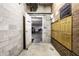 Building hallway featuring mailboxes and access to parking garage at 8690 Jaffa Ct W Dr # 28, Indianapolis, IN 46260