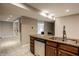 Functional kitchen island featuring a double sink and stainless steel dishwasher, great for meal prep at 8690 Jaffa Ct W Dr # 28, Indianapolis, IN 46260