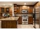 Well-equipped kitchen featuring stainless steel appliances, granite countertops, and ample cabinet space at 8690 Jaffa Ct W Dr # 28, Indianapolis, IN 46260
