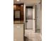 Laundry room with stacked washer and dryer units, conveniently located near the kitchen and stainless steel refrigerator at 8690 Jaffa Ct W Dr # 28, Indianapolis, IN 46260