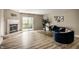 Bright and inviting living room with a fireplace, sliding doors, and stylish furniture at 8690 Jaffa Ct W Dr # 28, Indianapolis, IN 46260