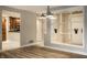 Open-concept living area with views of the modern kitchen and ample natural light at 8690 Jaffa Ct W Dr # 28, Indianapolis, IN 46260