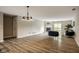Open living room with hardwood floors and recessed lighting, creating a warm and inviting atmosphere at 8690 Jaffa Ct W Dr # 28, Indianapolis, IN 46260