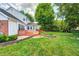 Spacious back yard featuring lawn, patio, and mature trees at 9158 Oak Knoll Ln, Fishers, IN 46037