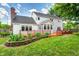 Beautiful back yard featuring large lawn, patio, and mature trees at 9158 Oak Knoll Ln, Fishers, IN 46037