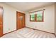 Bright bedroom featuring a wood door closet and window overlooking the green space at 9158 Oak Knoll Ln, Fishers, IN 46037