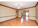 Versatile room featuring wood floors with trim and a doorway leading to other spaces in the home at 9158 Oak Knoll Ln, Fishers, IN 46037