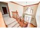 Bright two-story foyer featuring a chandelier and large window above the front door at 9158 Oak Knoll Ln, Fishers, IN 46037