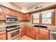 Modern kitchen featuring stainless steel appliances and generous counter space for culinary creativity at 9158 Oak Knoll Ln, Fishers, IN 46037
