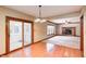 Inviting living room featuring a fireplace and access to the sunroom for a bright and airy space at 9158 Oak Knoll Ln, Fishers, IN 46037