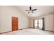 Bright main bedroom featuring carpet, a ceiling fan, and natural light at 9158 Oak Knoll Ln, Fishers, IN 46037