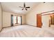 Spacious main bedroom with high ceilings, carpet, and natural light at 9158 Oak Knoll Ln, Fishers, IN 46037