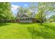 A large backyard with a sunroom that features high ceilings, perfect for relaxation and entertainment at 974 Arrowwood Dr, Carmel, IN 46033