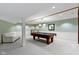 Basement featuring a pool table, white sofa, and neutral carpet at 974 Arrowwood Dr, Carmel, IN 46033