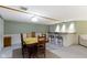 Basement featuring a dining table, chairs, bar, and neutral carpet at 974 Arrowwood Dr, Carmel, IN 46033