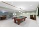 Finished basement with a pool table, dining table, bar, and neutral carpet at 974 Arrowwood Dr, Carmel, IN 46033