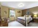 This cozy bedroom has neutral walls, trim and carpet, and a quaint window for natural light at 974 Arrowwood Dr, Carmel, IN 46033