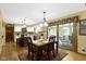 Sunlit dining area adjacent to the kitchen, perfect for casual meals and entertaining at 974 Arrowwood Dr, Carmel, IN 46033