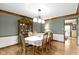 Formal dining room with hardwood floors, elegant table setting, and classic design at 974 Arrowwood Dr, Carmel, IN 46033