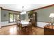 Sunlit dining room featuring hardwood floors, a large window, and a classic china cabinet at 974 Arrowwood Dr, Carmel, IN 46033