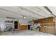 Spacious garage with overhead door, storage cabinets, and ample room for vehicles at 974 Arrowwood Dr, Carmel, IN 46033