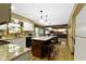 Bright, open kitchen with granite countertops, a center island, and stainless steel appliances at 974 Arrowwood Dr, Carmel, IN 46033
