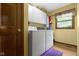Laundry room with a side-by-side washer and dryer and storage above at 974 Arrowwood Dr, Carmel, IN 46033