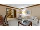 Spacious living room featuring classic decor and staircase view at 974 Arrowwood Dr, Carmel, IN 46033