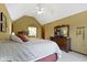 This primary bedroom features vaulted ceilings, neutral walls, and a decorative mirror on the dresser at 974 Arrowwood Dr, Carmel, IN 46033