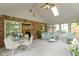 Bright sunroom with brick accents, skylight, and sliding door offering a relaxing view at 974 Arrowwood Dr, Carmel, IN 46033