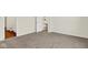 Bedroom view showcases carpeted floor, open door, and bathroom at 104 Maxim Ct, Cumberland, IN 46229