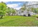 The house features a large, well-maintained backyard providing ample space for recreation and relaxation at 1124 S Lockburn St, Indianapolis, IN 46241